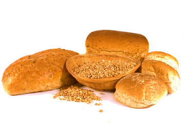 Assortment of Breads and Basket of Wheat Grains