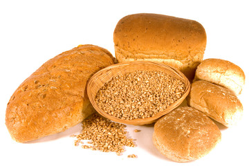 Assorted Breads around Basket of Wheat Grains
