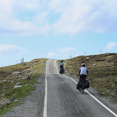 Fototapeta premium two cyclist cycling uphill