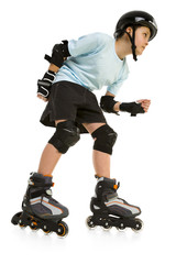 Young skater boy ready to ride on roller skates
