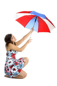Portrait of a young happy woman posing with an umbrella 