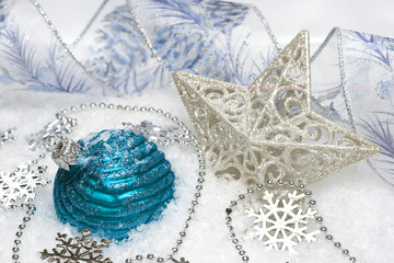 blue festive decoration and star on snow