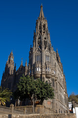 Fototapeta na wymiar old spanish catedral on grey stone under blue sky