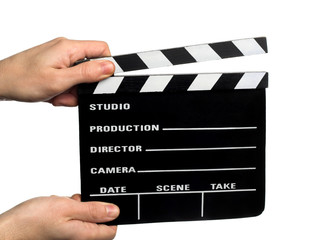 hands holding a movie clapper