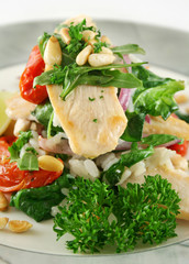 Chicken and pine nut stack with tomatoes and risotto..