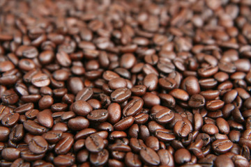A mixture of coffee beans used as a background