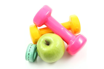 dumbbells and green apple - ready to fitness