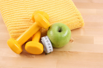 dumbbells towel and green apple - ready to fitness