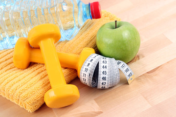 dumbbells towel and green apple - ready to fitness