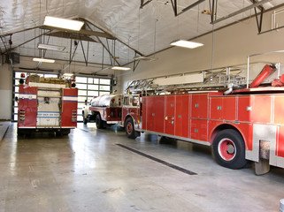 fire trucks in garage at the ready for a fire