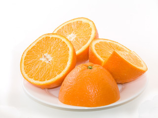 Sweet fresh oranges on the plate over white background