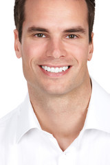 Fototapeta premium Smiling businessman. Isolated over white background.