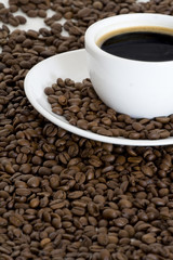 Cup of coffee and coffee beans background