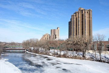 Residential Towers hovering over frozen river