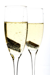 Glass of champagne with piece of chocolate inside