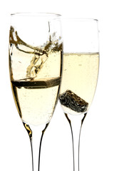 Glass of champagne with piece of chocolate inside