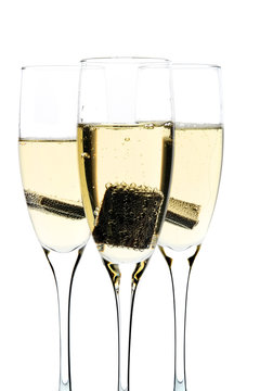 Glass of champagne with piece of chocolate inside