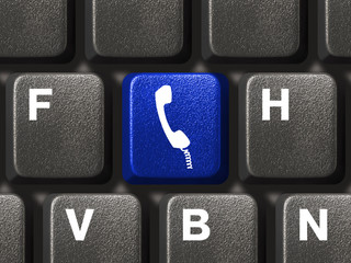 Computer keyboard with phone button, communication concept