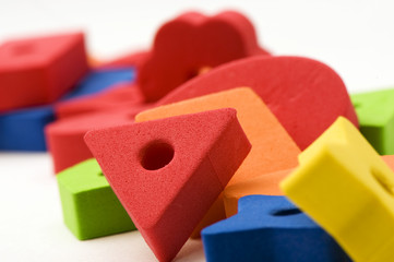 multicolored toys . Different shapes.  