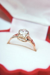 Golden ring with a diamond