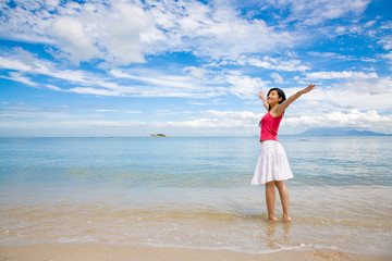 Fototapeta na wymiar beautiful red top girl & white skirt stretching on the beach