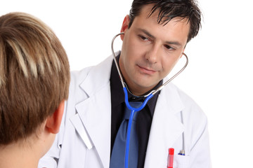 A sick young patient being examined by a medical doctor