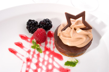 delicious chocolate cheesecake served with fresh raspberry