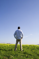 man back, locking away to the blue sky (with copyspace) © Helder Almeida