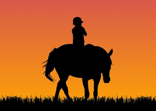 kid riding the horse at sunset
