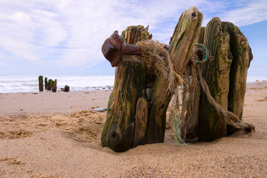 Waves washing over the groins at Sandsend, 