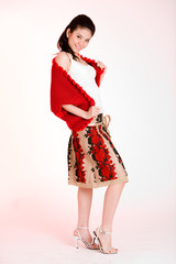 young expressive woman in floral skirt