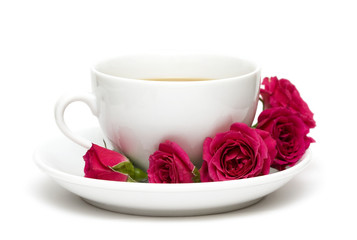 white cup of coffee with red roses