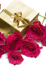 golden gift box with red roses