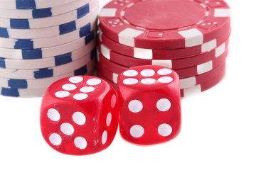 Two red dices with stacked chips in background