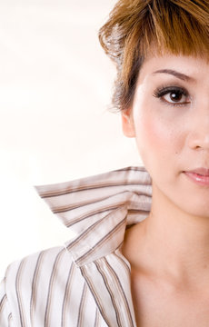 half face of a asian business woman with collar up
