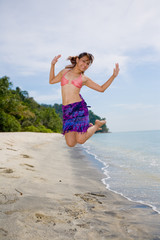jumping freely at the beach