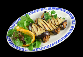 Chargrilled egg plant and beef rolls with an orange salad.