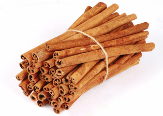 Big bundle of spicy cinnamon sticks isolated