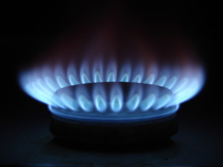 Blue flames of gas stove in the dark