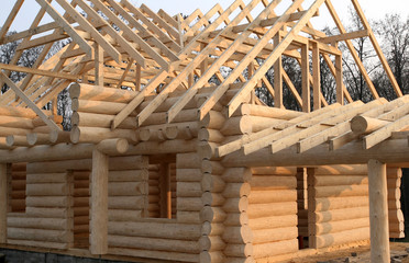 Wooden house construction. Residential architecture.