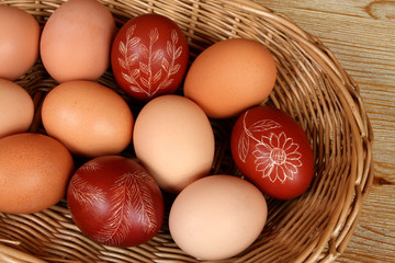 Ornate, traditional decorated Easter eggs in a wicker basket