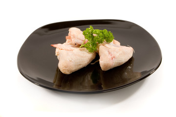 Raw Chicken Wings on Black Plate