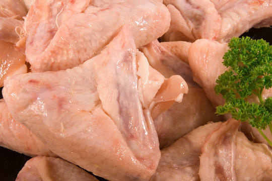 Close up of Raw Chicken Wings and Parsley