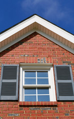 View of a window at the top of a house