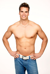 Smiling young strong  man. Isolated over white background.