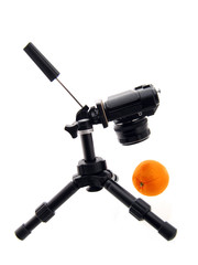Photographing of orange. Tripod and camera