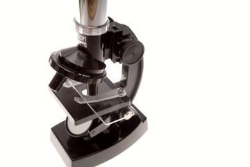 Microscope over white background