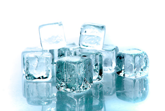 Blue ice cubes on white background