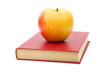 Book and apple, isolated on white background
