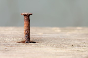 rusty nail in wood - 6404621